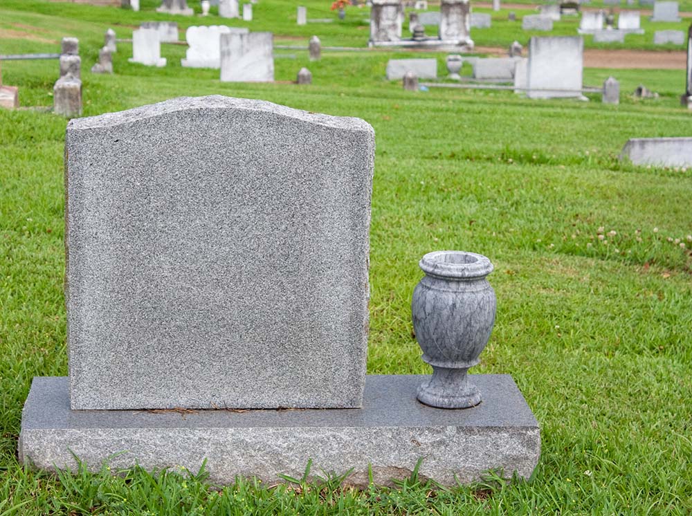 Headstone and vase in a cemetery